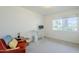 Minimalist office space with a desk, chair, and large window offering natural light at 314 E Royal Palm Rd, Phoenix, AZ 85020