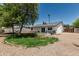 Backyard with grass, rock features, patio, and privacy wall at 343 W Santa Cruz Dr, Tempe, AZ 85282