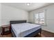 Bedroom featuring a bed, wood floors, baseboards, and white paint at 343 W Santa Cruz Dr, Tempe, AZ 85282