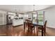 Bright kitchen with white cabinetry, stainless steel appliances, and an adjacent dining area at 343 W Santa Cruz Dr, Tempe, AZ 85282