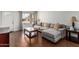 Comfortable living room with hardwood floors, neutral sofa, and bright natural light at 343 W Santa Cruz Dr, Tempe, AZ 85282