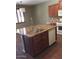 Spacious kitchen featuring wood cabinets, stone countertops and a large kitchen island at 3636 E Parkview Dr, Gilbert, AZ 85295