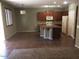 Open kitchen with a central island, tile flooring, and stainless steel appliances at 3636 E Parkview Dr, Gilbert, AZ 85295