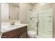 A bathroom showcases a clear glass shower enclosure paired with a modern vanity, designed for comfort and efficiency at 3948 E Caitlin Dr, San Tan Valley, AZ 85140