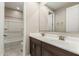 Bathroom featuring a double sink vanity with a large mirror and a shower-tub combination, providing a functional space at 3948 E Caitlin Dr, San Tan Valley, AZ 85140