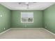 Bright bedroom showcasing a window and ceiling fan at 3948 E Caitlin Dr, San Tan Valley, AZ 85140