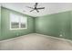 Bedroom with a neutral carpet, light-filled window, and modern ceiling fan at 3948 E Caitlin Dr, San Tan Valley, AZ 85140