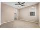 Bedroom featuring a ceiling fan, natural light, and a walk-in closet at 3948 E Caitlin Dr, San Tan Valley, AZ 85140