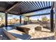 Outdoor community BBQ area with stainless steel grills, large table, and counter space at 3948 E Caitlin Dr, San Tan Valley, AZ 85140