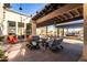 Outdoor patio with seating areas, pergolas, and desert landscaping at 3948 E Caitlin Dr, San Tan Valley, AZ 85140