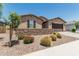 Well-maintained single-story home with a two-car garage, desert landscaping, and brick accents at 3948 E Caitlin Dr, San Tan Valley, AZ 85140