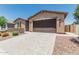 Charming single-story home with two-car garage, desert landscaping, and a paved driveway at 3948 E Caitlin Dr, San Tan Valley, AZ 85140