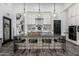 Modern kitchen with sleek island, stainless steel appliances, pendant lights, and ample storage space at 3948 E Caitlin Dr, San Tan Valley, AZ 85140