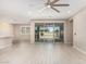 Bright living room features sliding glass doors to the backyard and neutral-toned walls and flooring at 3948 E Caitlin Dr, San Tan Valley, AZ 85140
