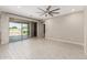 This living room features sliding glass doors that lead to the backyard and tile floors at 3948 E Caitlin Dr, San Tan Valley, AZ 85140