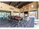 Gorgeous community lounge with gas fireplace, TV, long dining table for gathering with friends and Gathering at 3948 E Caitlin Dr, San Tan Valley, AZ 85140
