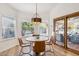Bright breakfast nook with backyard view, sliding glass doors to patio, and a modern pendant light at 4146 N Lomond --, Mesa, AZ 85215