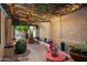 Outdoor courtyard with overhead wooden pergola, soft lighting and unique landscaping make for relaxing evenings at 4146 N Lomond --, Mesa, AZ 85215