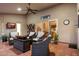 Spacious covered patio with tile flooring, comfortable seating, and ceiling fan for relaxation and entertainment at 4146 N Lomond --, Mesa, AZ 85215