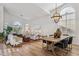 Dining and Living space with views, wood floors, and arched windows create an inviting atmosphere at 4146 N Lomond --, Mesa, AZ 85215