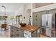 Spacious kitchen island features a wood countertop and lots of storage space, along with stainless steel appliances at 4146 N Lomond --, Mesa, AZ 85215