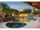 Entertain friends in this backyard oasis with a beautiful pool, spa and lush landscaping under the evening sky at 4146 N Lomond --, Mesa, AZ 85215