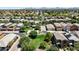 An aerial view shows houses surrounded by lush landscaping with mountain views in this desirable community at 4379 E Rosemonte Dr, Phoenix, AZ 85050
