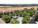 Aerial view of a neighborhood pool, surrounded by trees, with the community visible at 4379 E Rosemonte Dr, Phoenix, AZ 85050