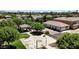 An aerial view of a common area featuring a gazebo, seating, basketball court, mature trees and lush green grass at 4379 E Rosemonte Dr, Phoenix, AZ 85050