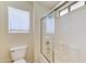 Clean and functional bathroom with a shower-tub combo, toilet, and window for natural light at 4379 E Rosemonte Dr, Phoenix, AZ 85050