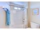 Bright, white bathroom with a shower-tub, white subway tile and a small window at 4379 E Rosemonte Dr, Phoenix, AZ 85050