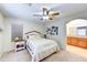 Bright bedroom with a full ensuite bathroom showcasing a comfortable bed and neutral decor at 4379 E Rosemonte Dr, Phoenix, AZ 85050