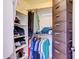 Organized walk-in closet with shelving, hanging racks, and ample space for storing clothes and personal items at 4379 E Rosemonte Dr, Phoenix, AZ 85050