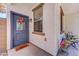 Inviting front porch with decorative door and a cozy seating area, perfect for enjoying the outdoors and neighborhood views at 4379 E Rosemonte Dr, Phoenix, AZ 85050