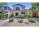 Charming two-story home with landscaped yard, desert landscaping, and covered front porch at 4379 E Rosemonte Dr, Phoenix, AZ 85050