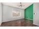 Bright room features ceiling fan, beautiful floors, and a large window with blinds at 4601 N 102Nd Ave # 1178, Phoenix, AZ 85037