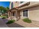 Two-story home featuring stucco exterior, decorative columns, and well-kept desert landscaping at 4601 N 102Nd Ave # 1178, Phoenix, AZ 85037