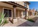 Charming two-story home with a stucco facade, decorative columns, and well-maintained landscaping at 4601 N 102Nd Ave # 1178, Phoenix, AZ 85037