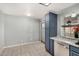 Eat-in kitchen with stainless steel appliances, granite counters, blue cabinets and bright lighting at 4601 N 102Nd Ave # 1178, Phoenix, AZ 85037