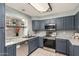 Contemporary kitchen boasts stainless steel appliances, granite countertops and plenty of storage at 4601 N 102Nd Ave # 1178, Phoenix, AZ 85037