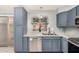 Well-lit kitchen features granite countertops, stainless steel appliances and ample cabinet space at 4601 N 102Nd Ave # 1178, Phoenix, AZ 85037