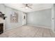 Cozy living room boasts bright lighting, tile flooring, fireplace, and neutral wall paint at 4601 N 102Nd Ave # 1178, Phoenix, AZ 85037