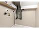 Utility room featuring a shelf, water heater, and washer/dryer hookups at 4601 N 102Nd Ave # 1178, Phoenix, AZ 85037