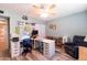 Spacious bedroom with a ceiling fan, laminate floors, and lots of space for working at 5751 W Muriel Dr, Glendale, AZ 85308