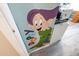 Bedroom wall featuring a cartoon of the character Dopey from Disney's 'Snow White and the Seven Dwarfs' at 5751 W Muriel Dr, Glendale, AZ 85308