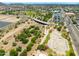 Community featuring baseball fields, a skate park, and a bridge surrounded by green spaces and a picturesque landscape at 5751 W Muriel Dr, Glendale, AZ 85308
