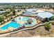 Aerial image of a community center pool with slides, lap lanes, and picnic tables, a great place to relax and have fun at 5751 W Muriel Dr, Glendale, AZ 85308