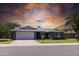 Charming single-story home featuring a well-maintained lawn and a two-car garage at 5751 W Muriel Dr, Glendale, AZ 85308