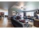 Open-concept living area with comfortable seating, neutral colors, and sliding glass doors at 5751 W Muriel Dr, Glendale, AZ 85308