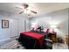 Serene main bedroom features coordinated decor, ceiling fan, and sliding closet doors at 5751 W Muriel Dr, Glendale, AZ 85308